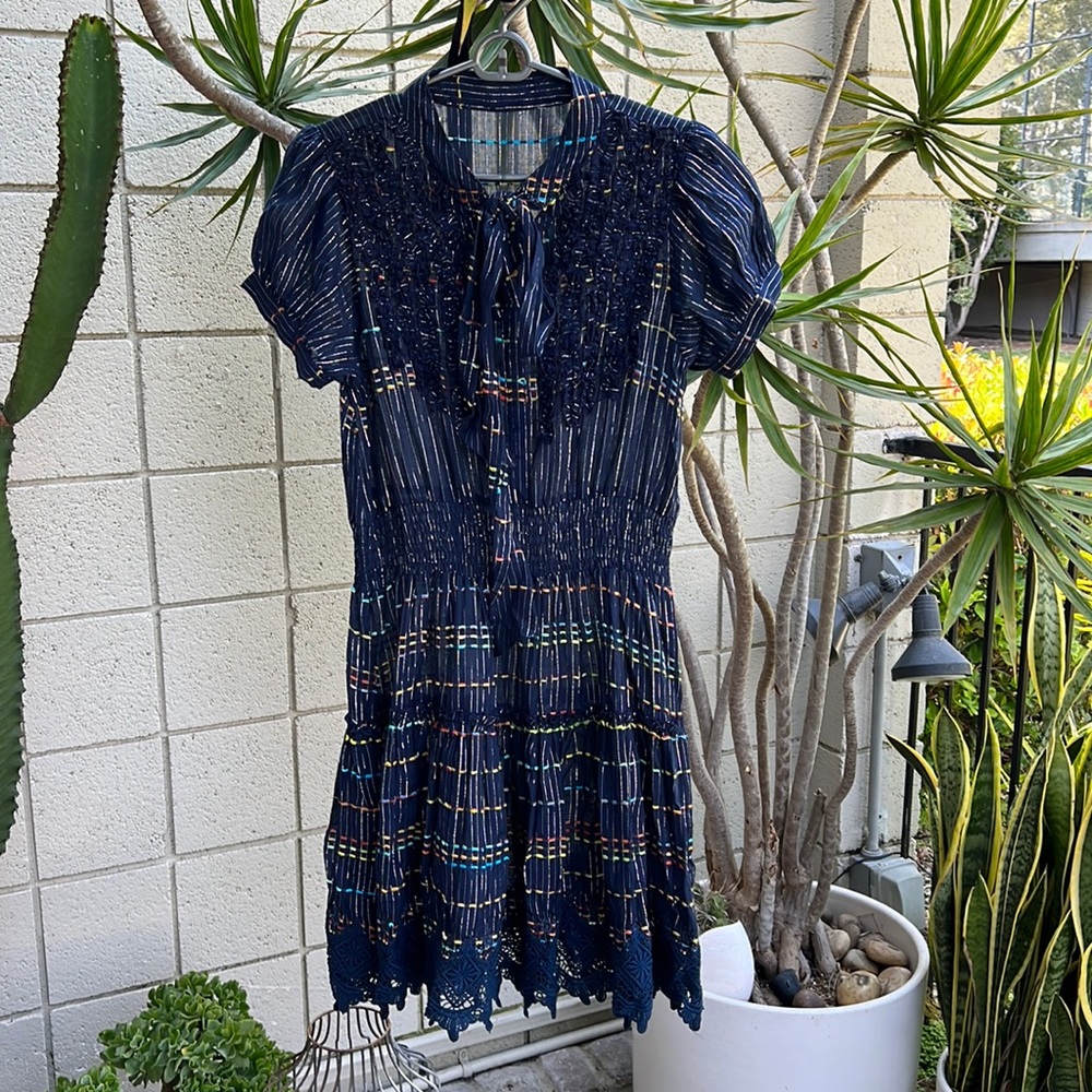 Short metallic and multicolored stripe dress.